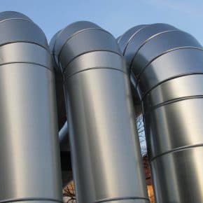 Large metal tubes commonly found on geothermal power plants.