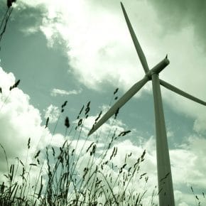 A wind turbine harnessing wind energy.