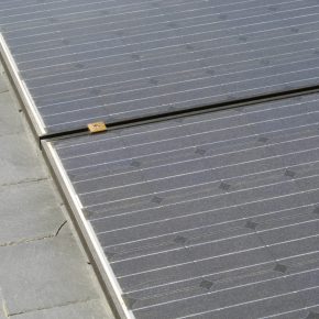 Solar roof tiles blending in with existing roof slates.