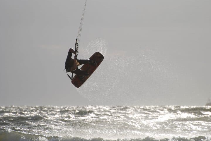 A kite surfer showing one of the uses of wind energy.
