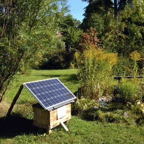 A solar panel being used to provide power in a garden.