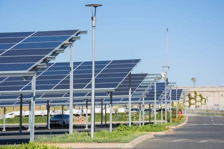 A solar panel canopy over a car park.